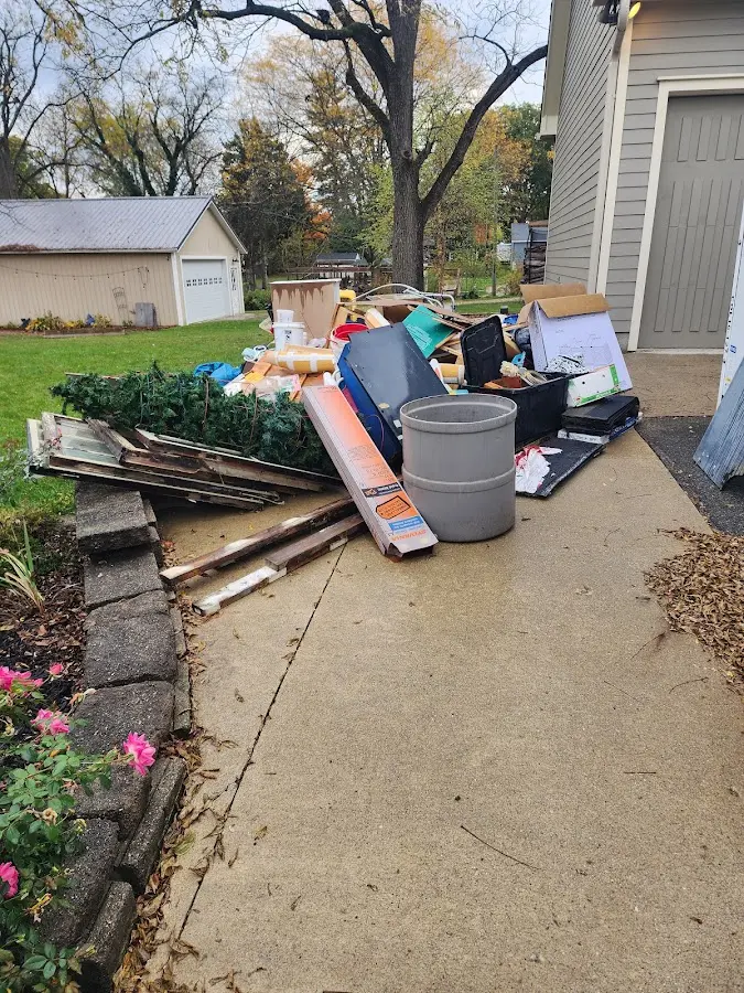Dumpster being loaded with debris for Commercial Dumpster Rental in Alamogordo